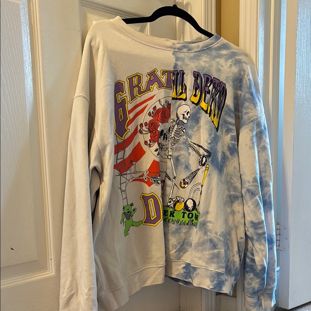 Divided White and Blue Crewneck Sweater with Artistic Flair